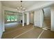 Bright living room featuring an elegant chandelier and a staircase, awaiting its final touches at 679 Crest Line Trl, Powder Springs, GA 30127
