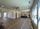 Open concept living space featuring abundant windows, a ceiling fan, recessed lighting, and a view of the kitchen at 679 Crest Line Trl, Powder Springs, GA 30127