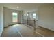 Bright loft with views from three windows, stairway and wooden banister at 679 Crest Line Trl, Powder Springs, GA 30127