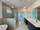 Modern main bathroom with a walk-in shower, soaker tub, and a double vanity at 679 Crest Line Trl, Powder Springs, GA 30127