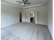 Spacious carpeted main bedroom with many windows that let in natural light at 679 Crest Line Trl, Powder Springs, GA 30127