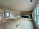 Open-concept space featuring a kitchen with a blue island, cabinets, and ample natural light at 679 Crest Line Trl, Powder Springs, GA 30127