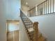 A modern staircase with sleek, black metal and natural wood railing at 679 Crest Line Trl, Powder Springs, GA 30127