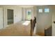 Staircase with an unfinished upstairs and an outside view from windows in the space at 679 Crest Line Trl, Powder Springs, GA 30127