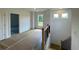 Upstairs landing with natural light and views from the window at 679 Crest Line Trl, Powder Springs, GA 30127