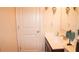 Well-lit bathroom featuring vanity with white countertop, mirror, and decorative sconces at 1320 Newbridge Cir, Buford, GA 30519