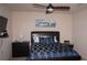 Bedroom features include a fan and a leather headboard with matching end tables at 1320 Newbridge Cir, Buford, GA 30519