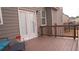 View of the back deck featuring stained wood, modern furniture, french doors and a wooded view at 1320 Newbridge Cir, Buford, GA 30519