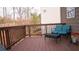 Outdoor deck with furniture overlooking wooded backyard at 1320 Newbridge Cir, Buford, GA 30519