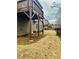 View of the home's wooden deck supported by brown beams in backyard at 1320 Newbridge Cir, Buford, GA 30519