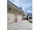 View of the two-car garage, with brick and stone accents, complementing the home's facade at 1320 Newbridge Cir, Buford, GA 30519