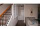 Spacious hallway leading to staircase and living room with neutral paint and hardwood floors at 1320 Newbridge Cir, Buford, GA 30519