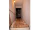 Staircase with uncarpeted wood steps leading to the basement at 1320 Newbridge Cir, Buford, GA 30519