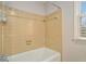 Bathroom with beige tile shower and tub at 1519 Carnaby Ct, Dunwoody, GA 30338