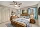 Bright bedroom with natural light, a ceiling fan, and wooden furniture at 1519 Carnaby Ct, Dunwoody, GA 30338