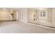 Open dining area with carpeting, and a view into the kitchen at 1519 Carnaby Ct, Dunwoody, GA 30338