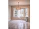 Bright dining room with neutral tones and a large window that provides plenty of natural light at 1519 Carnaby Ct, Dunwoody, GA 30338