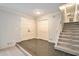 Bright entryway with tiled floor, double doors, and staircase leading upstairs at 1519 Carnaby Ct, Dunwoody, GA 30338