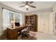 Home office with built-in bookcase and hardwood desk at 1519 Carnaby Ct, Dunwoody, GA 30338