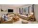 Spacious living room featuring bay windows, neutral carpeting, and ample natural light at 1519 Carnaby Ct, Dunwoody, GA 30338