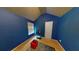 Blue bedroom with a small desk and window at 5789 Star Flower Dr, Ellenwood, GA 30294