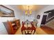 Formal dining room with hardwood floors and chandelier at 5789 Star Flower Dr, Ellenwood, GA 30294