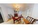 Cozy dining room with a table, chairs, and bay window at 5789 Star Flower Dr, Ellenwood, GA 30294