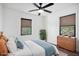 Virtually staged bedroom with a dresser and ceiling fan at 942 Azalea Cir, Marietta, GA 30062