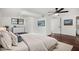 Bright bedroom with a plush bed, dresser, and hardwood floors at 942 Azalea Cir, Marietta, GA 30062