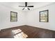 Spacious bedroom with dark hardwood floors and ceiling fan at 942 Azalea Cir, Marietta, GA 30062