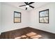 Bright bedroom with dark brown flooring and ceiling fan at 942 Azalea Cir, Marietta, GA 30062