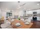 Modern dining room with light wood table and white cabinets at 942 Azalea Cir, Marietta, GA 30062