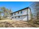 Rear view of a two-story house with white siding at 942 Azalea Cir, Marietta, GA 30062