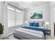 Virtually staged bedroom with blue accents and neutral decor at 1208 Stone Castle Cir # 3, Smyrna, GA 30080