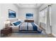 Virtually staged main bedroom with neutral tones and blue accents at 1208 Stone Castle Cir # 3, Smyrna, GA 30080
