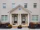 Two-unit townhome building with a shared front porch and landscaping at 1208 Stone Castle Cir # 3, Smyrna, GA 30080