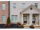 Front view of townhome with double doors and landscaping at 1208 Stone Castle Cir # 3, Smyrna, GA 30080