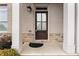 Inviting front door entry with brick facade and stone detailing at 1208 Stone Castle Cir # 3, Smyrna, GA 30080