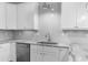 White cabinets, granite countertops, and tile backsplash at 1208 Stone Castle Cir # 3, Smyrna, GA 30080