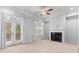 Spacious living room featuring a fireplace and access to a deck at 1208 Stone Castle Cir # 3, Smyrna, GA 30080