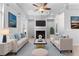 Virtually staged living room with light beige couches and blue pillows at 1208 Stone Castle Cir # 3, Smyrna, GA 30080