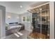 A luxurious bathroom featuring a soaking tub and modern glass enclosed shower at 202 Heights Pl, Canton, GA 30114