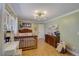 Beautiful bedroom with hardwood floors, modern lighting, and comfortable furnishings at 202 Heights Pl, Canton, GA 30114