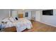 Spacious bedroom with hardwood floors, a calming color scheme, and access to the bathroom at 202 Heights Pl, Canton, GA 30114