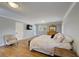 Comfortable bedroom with neutral walls, hardwood floors, natural light, and plenty of space at 202 Heights Pl, Canton, GA 30114
