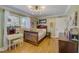 Charming bedroom with hardwood floors, a large window, and stylish decor at 202 Heights Pl, Canton, GA 30114