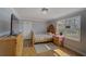 Cozy bedroom with soft colors, wood accents, natural light, and hardwood floors at 202 Heights Pl, Canton, GA 30114