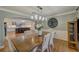 Light and airy dining room, open to kitchen, with wood floors and trim at 202 Heights Pl, Canton, GA 30114