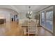 Bright dining room with wood floors, with view to the kitchen and porch at 202 Heights Pl, Canton, GA 30114
