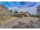 Long ranch home featuring a well-manicured lawn, lovely landscape, and an attached garage at 202 Heights Pl, Canton, GA 30114